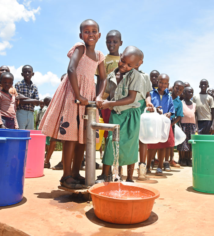 Kids pour clean water