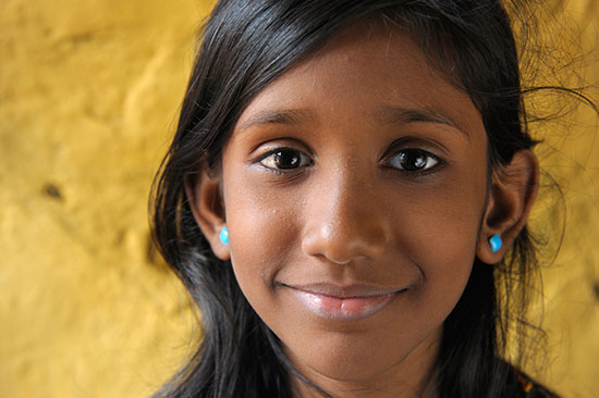 A young girl smiling