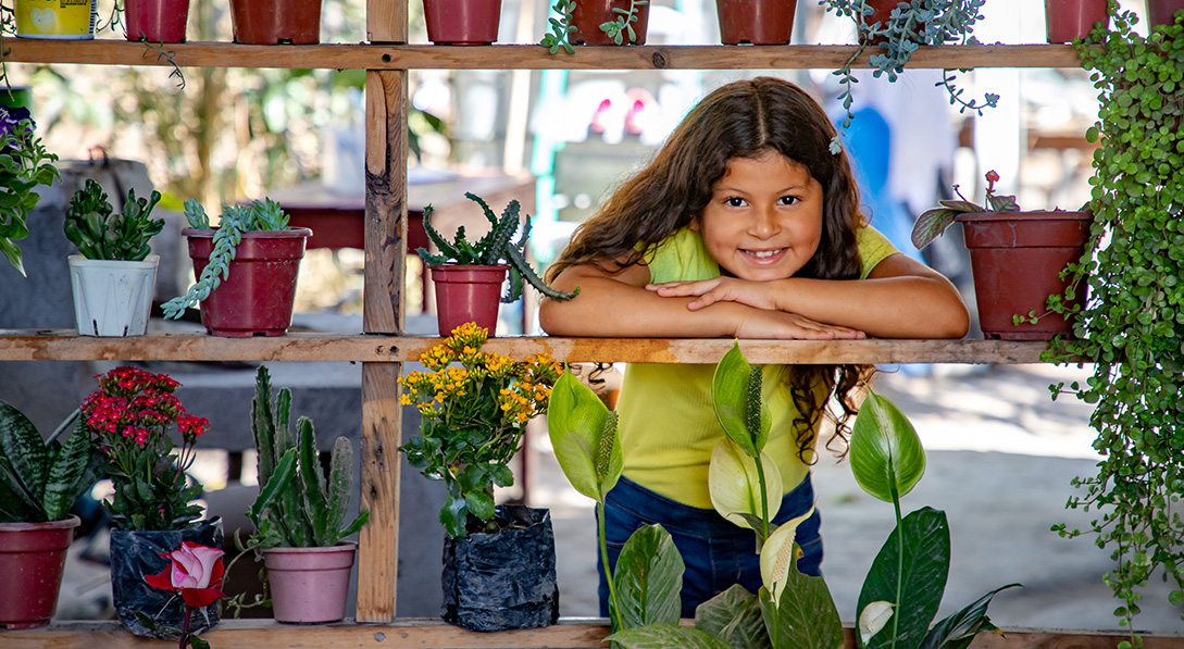 Valeria shows off some of her plants