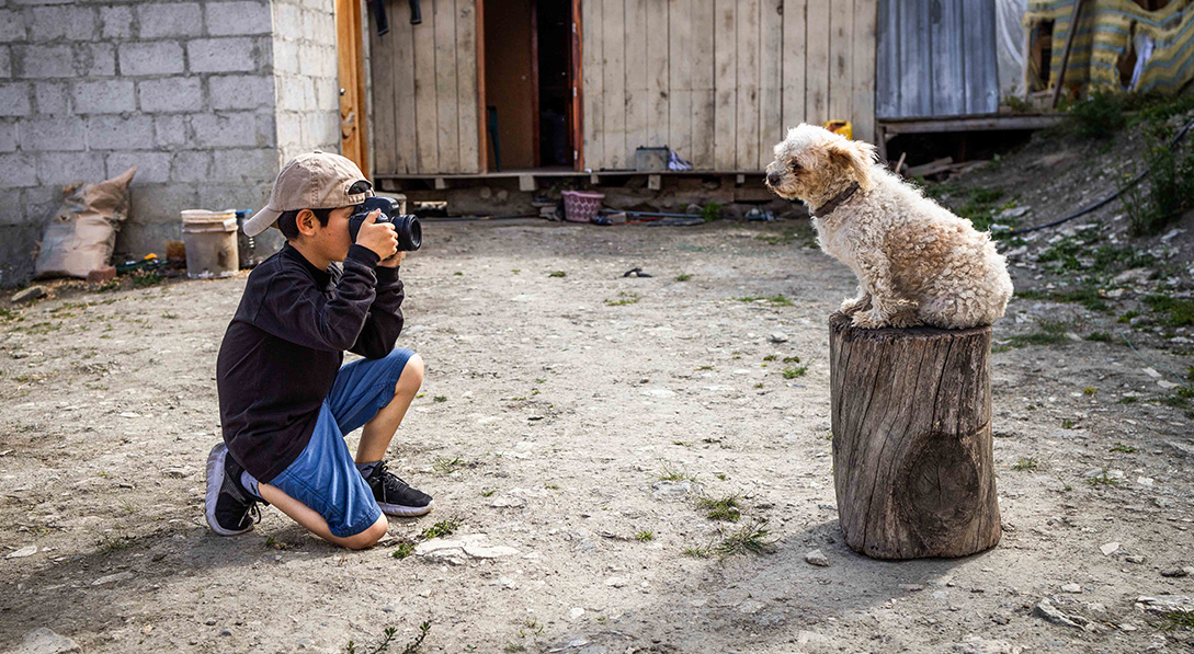 Neymar of Ecuador photographs a dog.