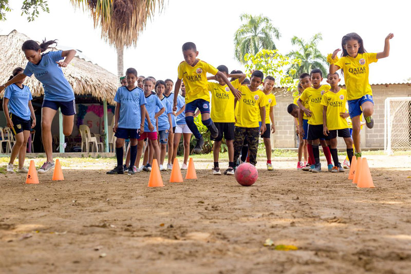 Children learn soccer skills at their child development center