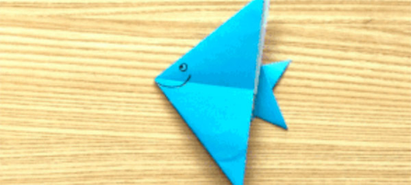 a folded origami paper fish