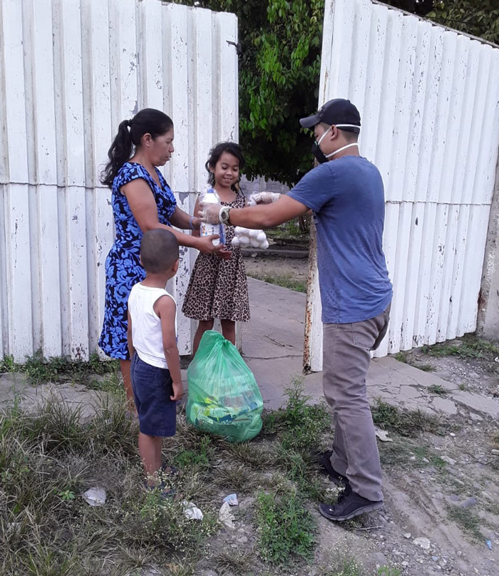 a family carrying dry goods