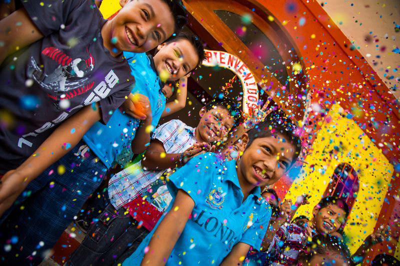 Children celebrate with confetti