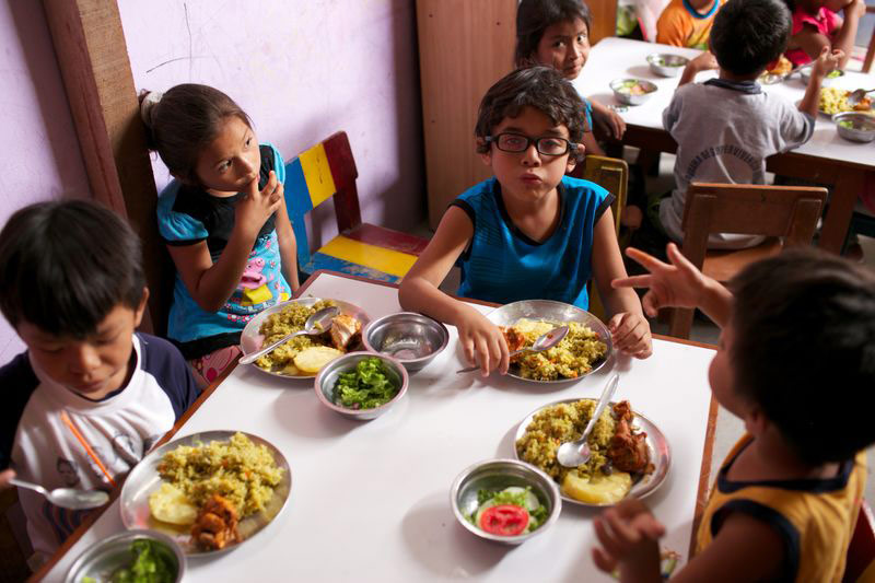 Children eating a nutritious meal at their child development center