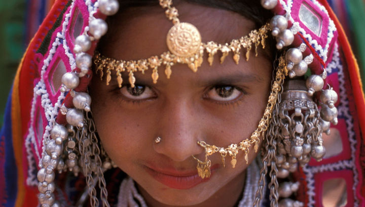 An Indian girl dressed in her ceremonial dress