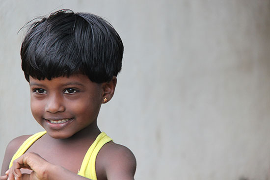 A young child smiling