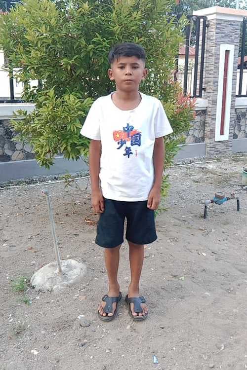 An unsponsored boy named Opo from Indonesia who has waited 509 days for a sponsor.