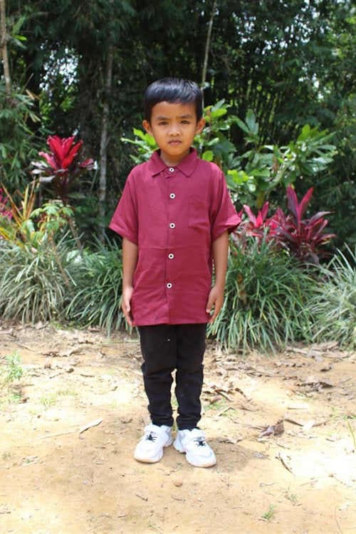 An unsponsored boy named Dieng from Indonesia who has waited 421 days for a sponsor.
