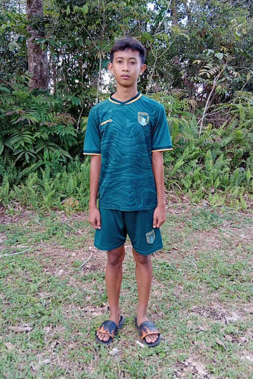 An unsponsored boy named Hendrikus from Indonesia who has waited 48 days for a sponsor.