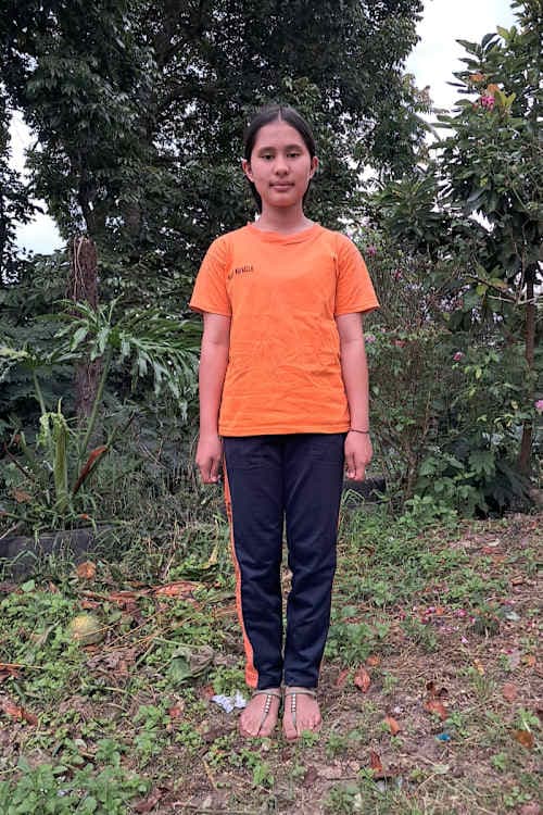 An unsponsored girl named Nadine from Indonesia who has waited 460 days for a sponsor.