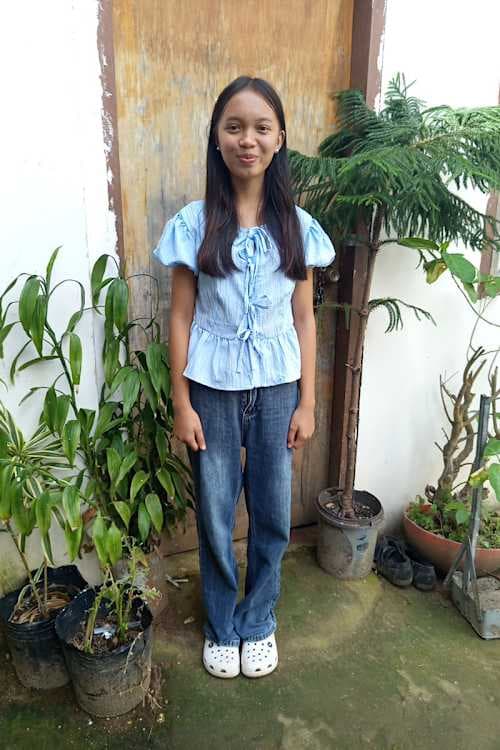 An unsponsored girl named Miljie from Philippines who has waited 158 days for a sponsor.