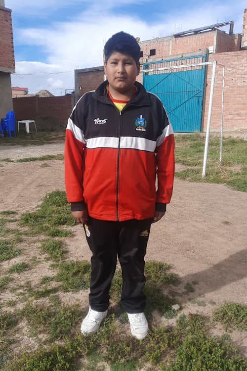 An unsponsored boy named Adelin from Bolivia who has waited 327 days for a sponsor.