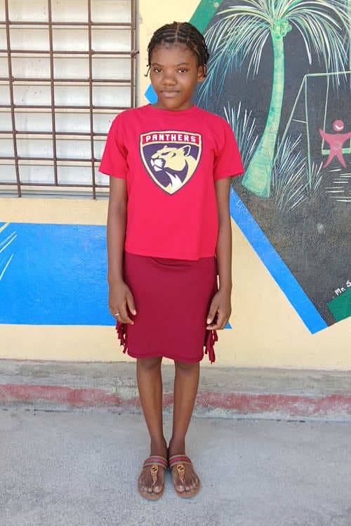 An unsponsored girl named Kirya from Haiti who is vulnerable to exploitation and has waited 653 days for a sponsor.