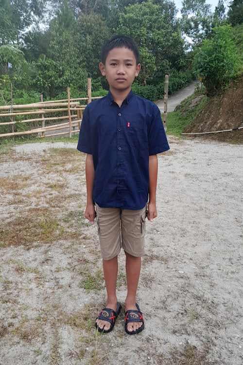 An unsponsored boy named Jastin from Indonesia who has waited 478 days for a sponsor.