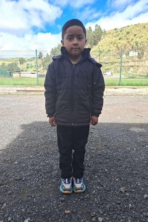 An unsponsored boy named Izan from Ecuador who has waited 585 days for a sponsor.