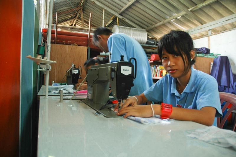 Thailand Girl At Sewing Machine