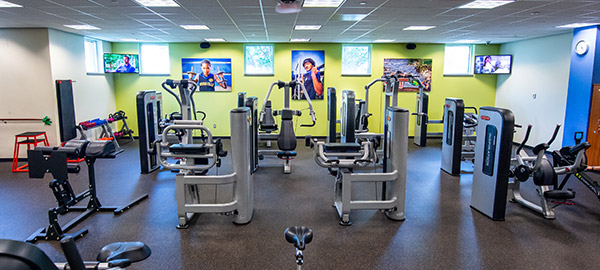 Compassion employee gym with different workout equipment