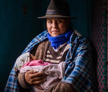 a mother holds her child