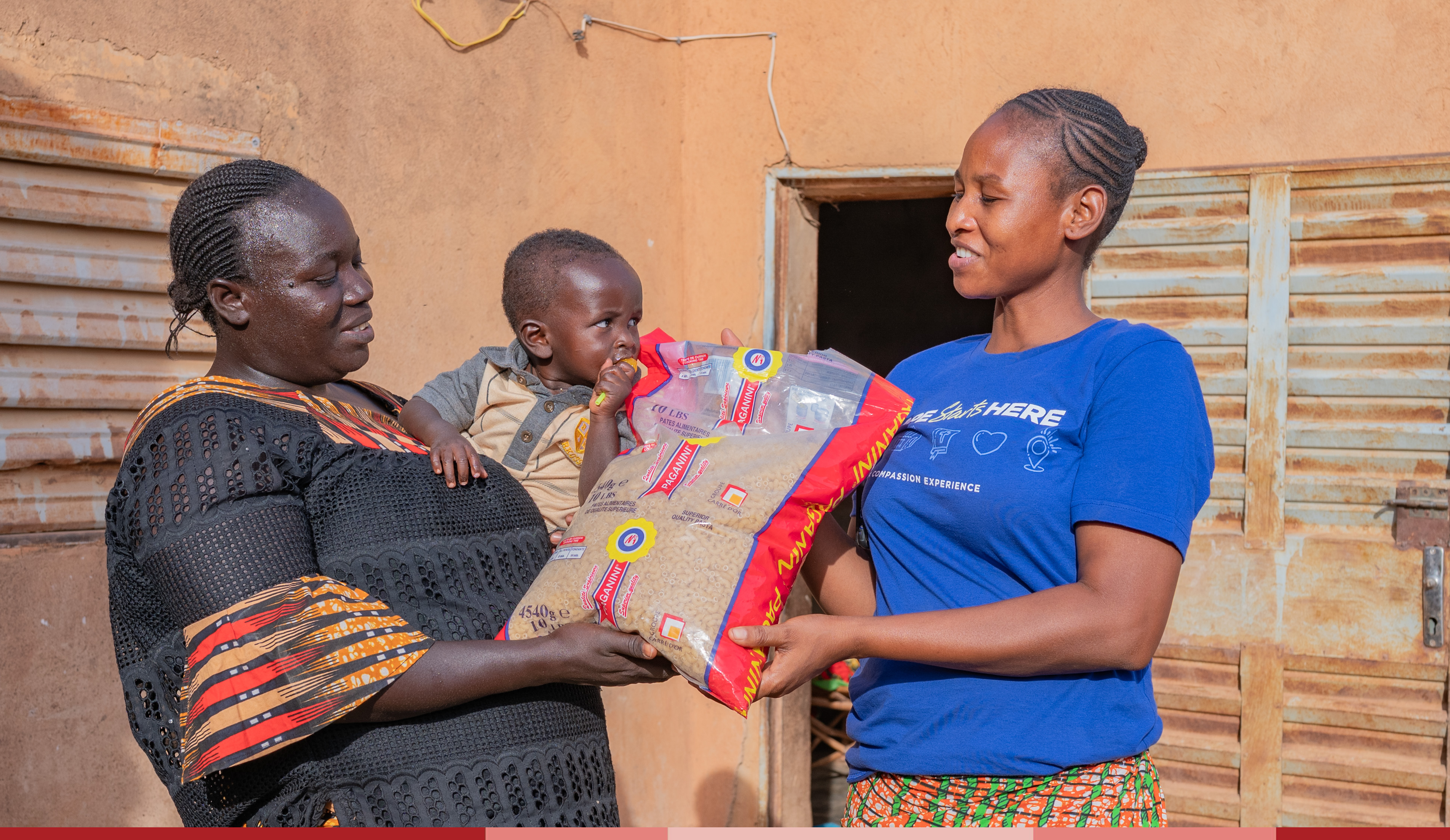 Lea delivers a food kit to Nathalie and her baby Steeve