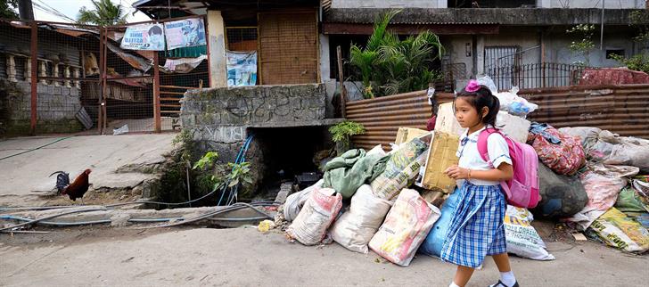 Girl walking down the street with backpack