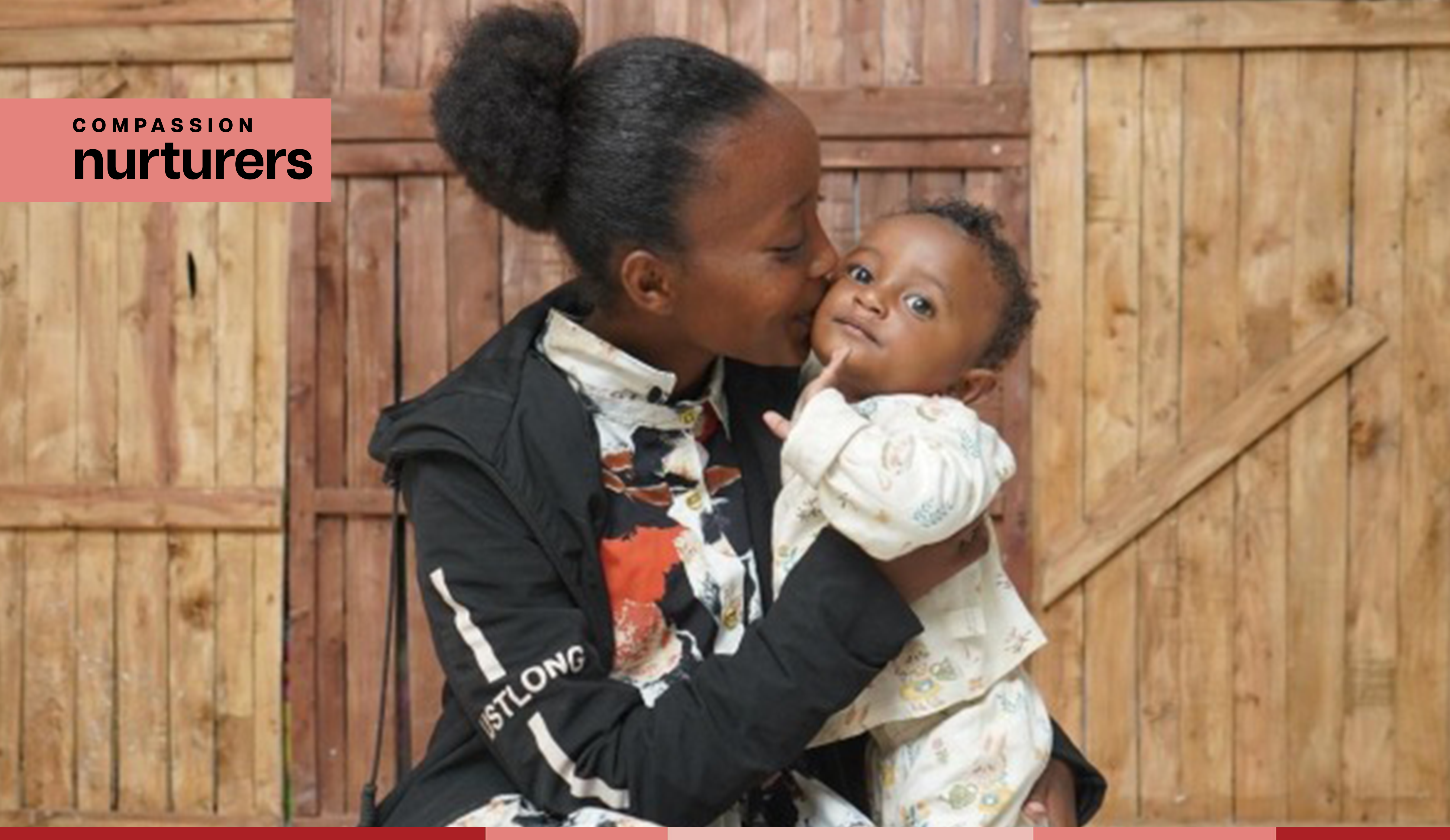 Zertihun kisses baby Barnabas on the cheek