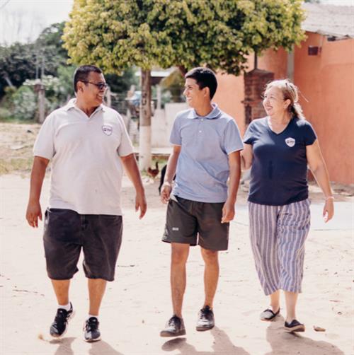 child walking with mentors