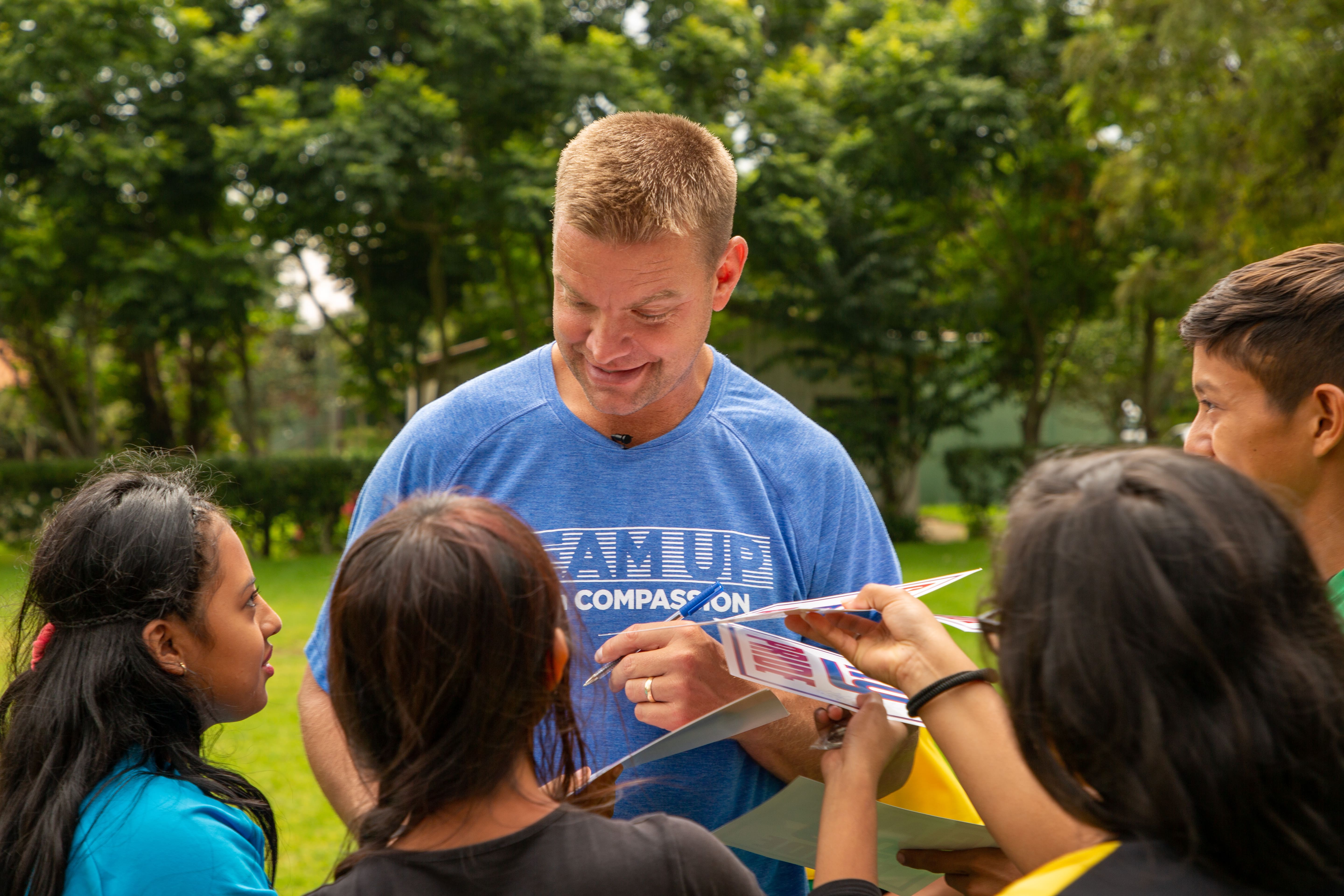 Pro athlete gives autograph to children in Guatemala
