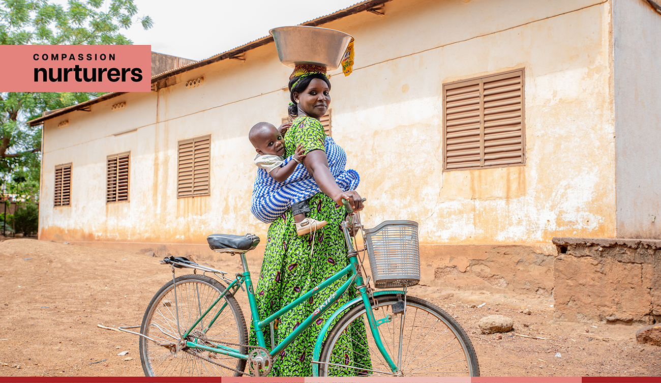 Maria carries her baby on her back with a traditional baby wrap