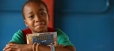girl holds a bible