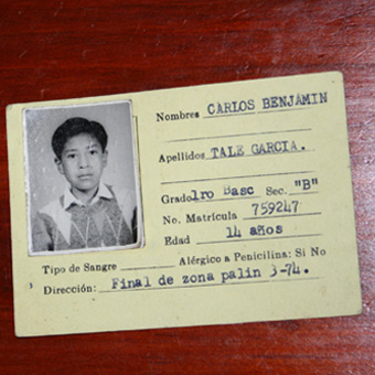 Carlos's identification card as a child
