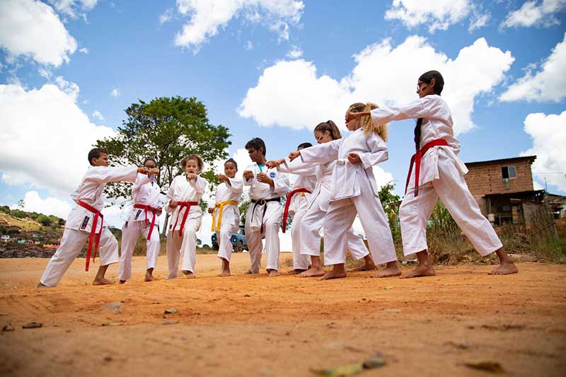 A group of students practice karate
