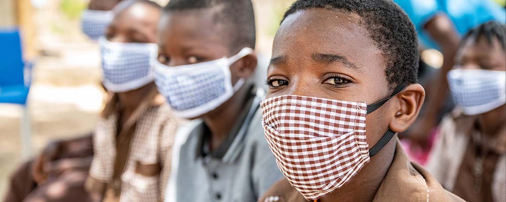 Children in Burkina Faso wearing masks