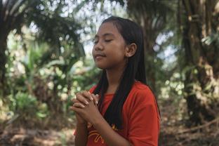 Tivani prays outside