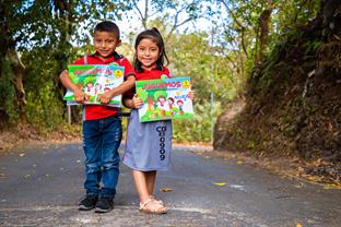 Edwin and Ariadne hold their books