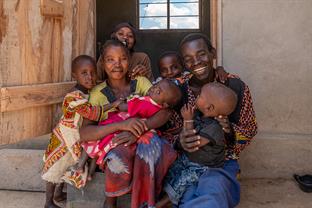 Nikola and Emiliana with their family in front of their house