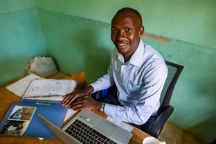 Michael works at his desk