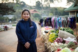 Jinda is standing at the market