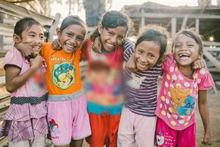a group of girls smile at the camera