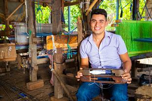 Mauricio sits in his workshop