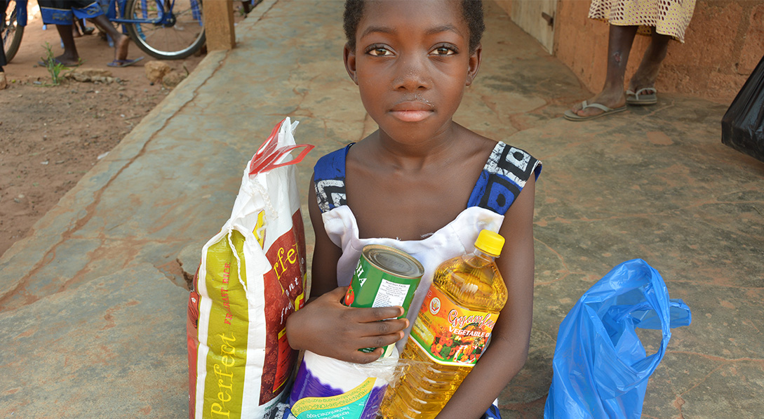 a girl holds some food items