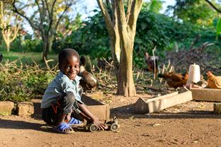 a boy plays with a toy