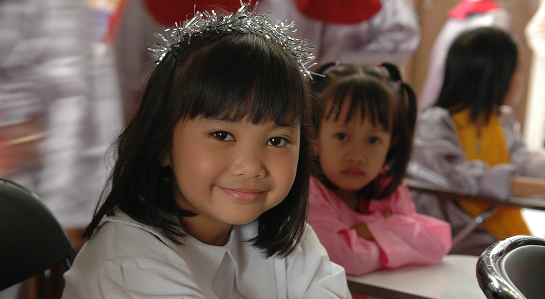 a young girl dressed as an angel