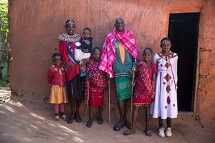 the family stands outside their home