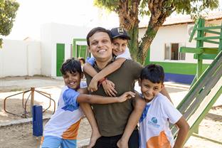 Eraldo, with three boys at the center he used to attend