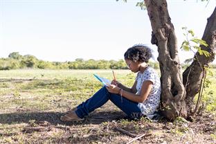 a girl writes a letter to her sponsor