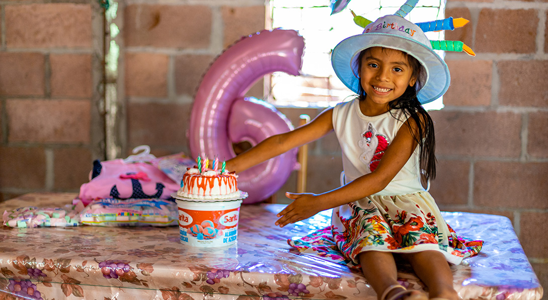 a young girl celebrates her birthday