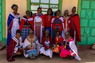 group of women standing in front of church