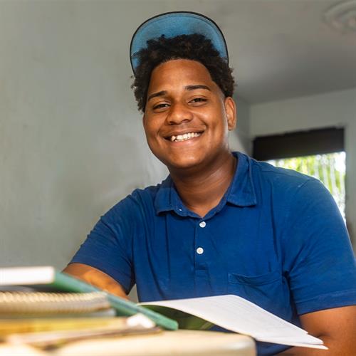 Teen smiles because he is learning and growing