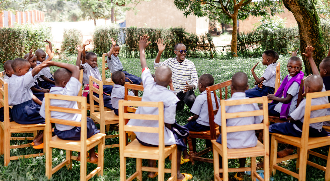 Emma speaks to a group of children at a local child development center.